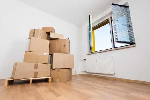 Local moving team handling furniture and boxes in Elmstead