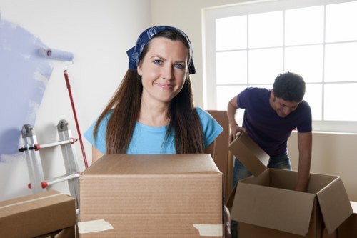 Packed boxes and furniture ready for house removals in Elmstead
