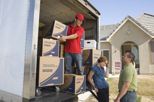 Staff member checking moving equipment and protective measures