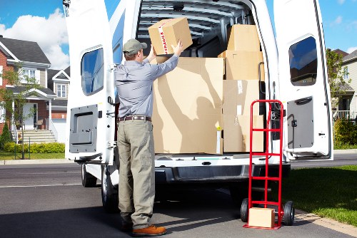 Loading household items into a van for a move in Elmstead