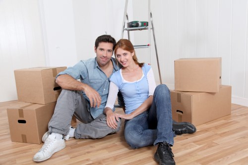 Packed boxes and furniture ready for removal service in Elmstead