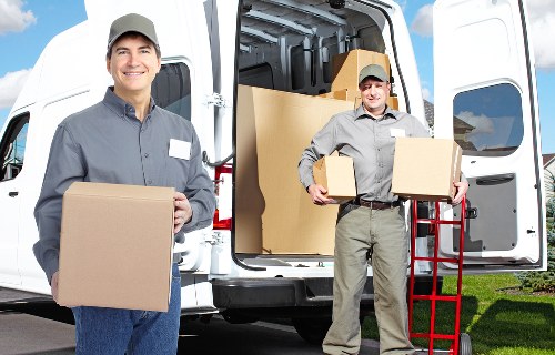 Local packing team organising fragile household items in Elmstead