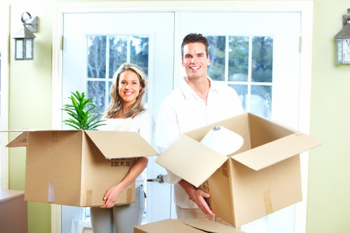 Loading household items into a moving van in Elmstead